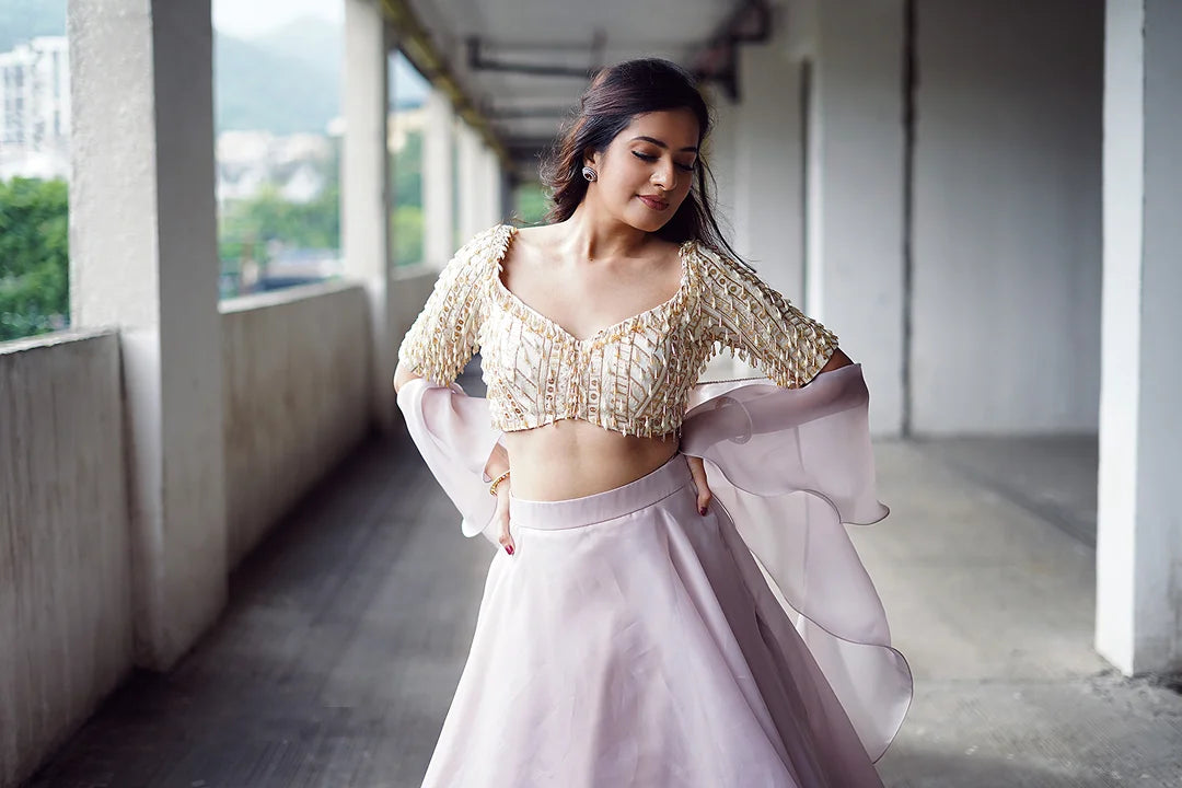 Lilac organza lehenga and embroidered blouse.