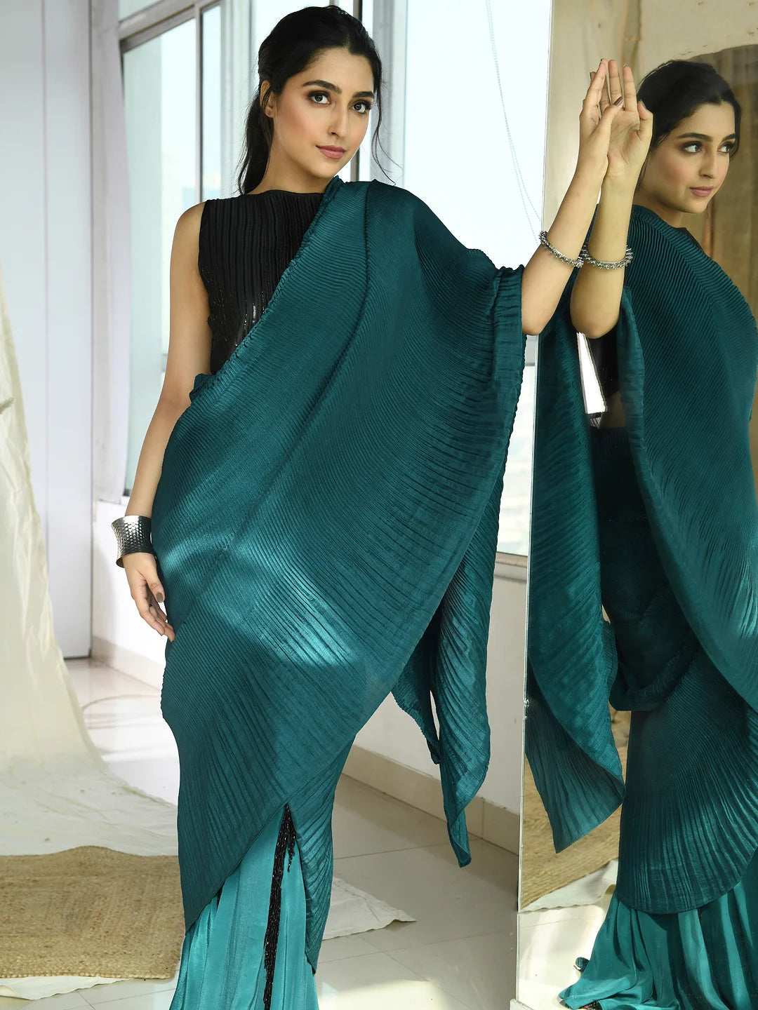 Teal pleated fringe saree with pleated embroidered blouse