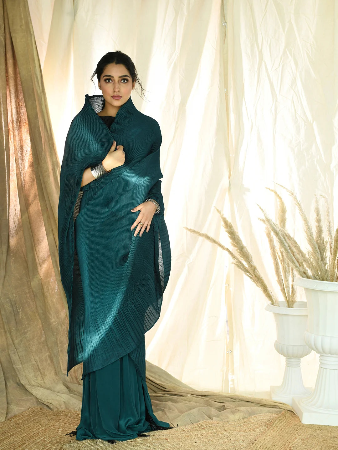Teal pleated fringe saree with pleated embroidered blouse