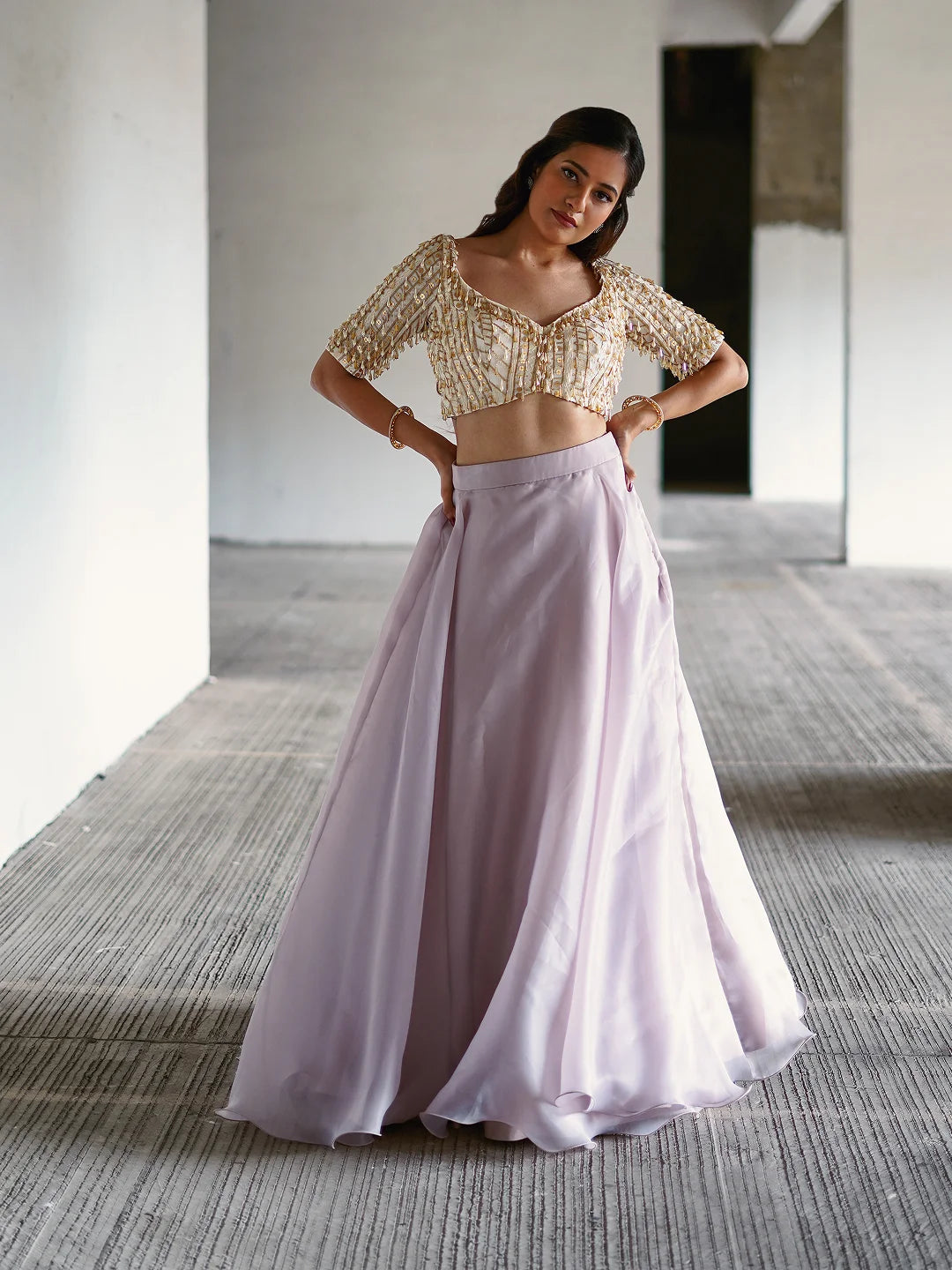 Lilac organza lehenga and embroidered blouse.
