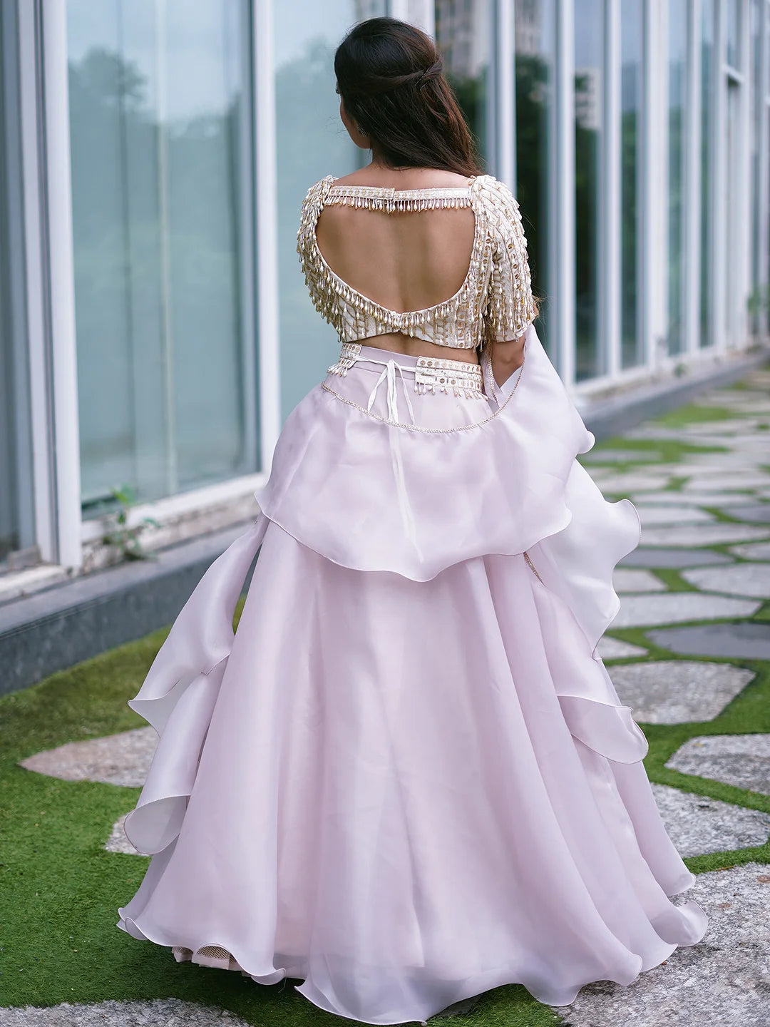 Lilac organza lehenga and embroidered blouse.