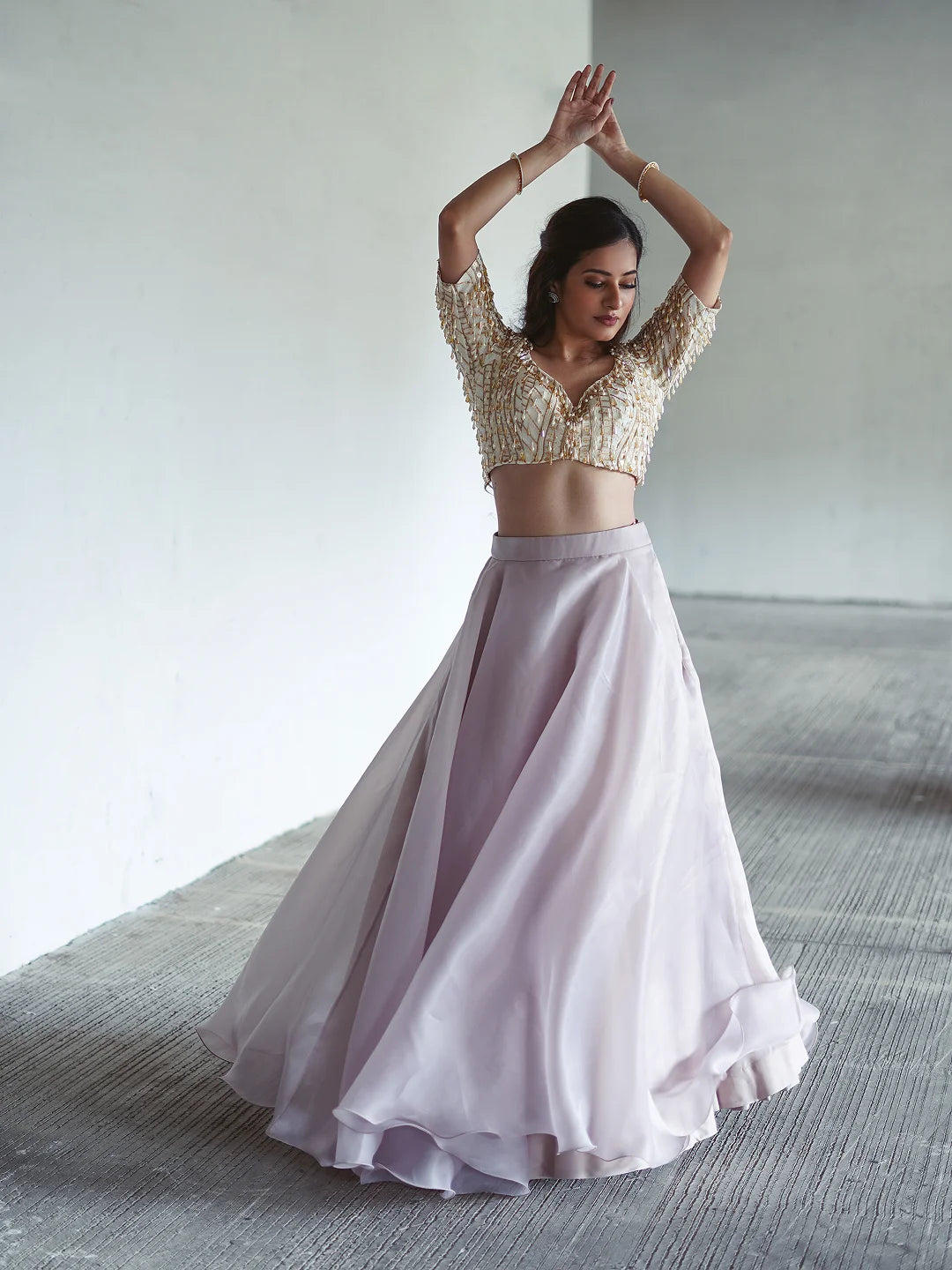 Lilac organza lehenga and embroidered blouse.