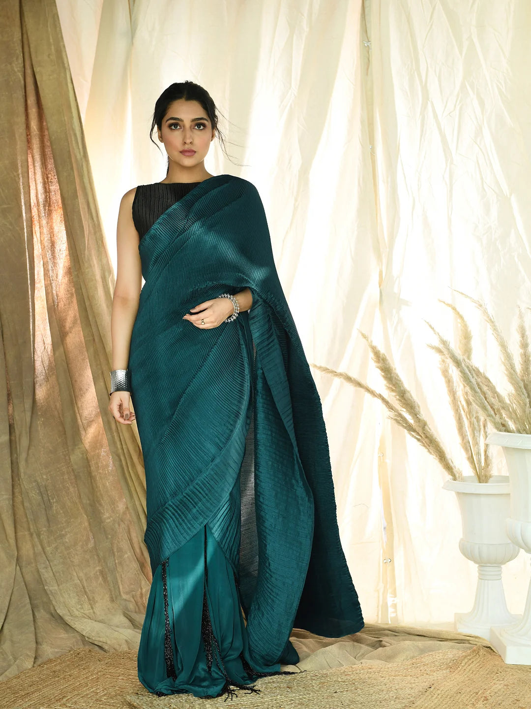 Teal pleated fringe saree with pleated embroidered blouse