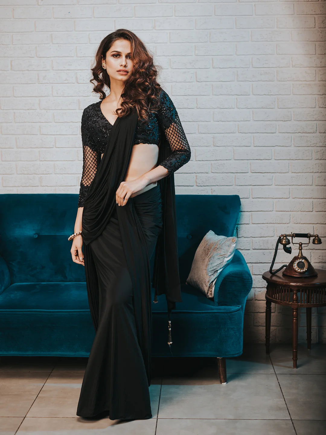 Black draped saree with embroidered blouse