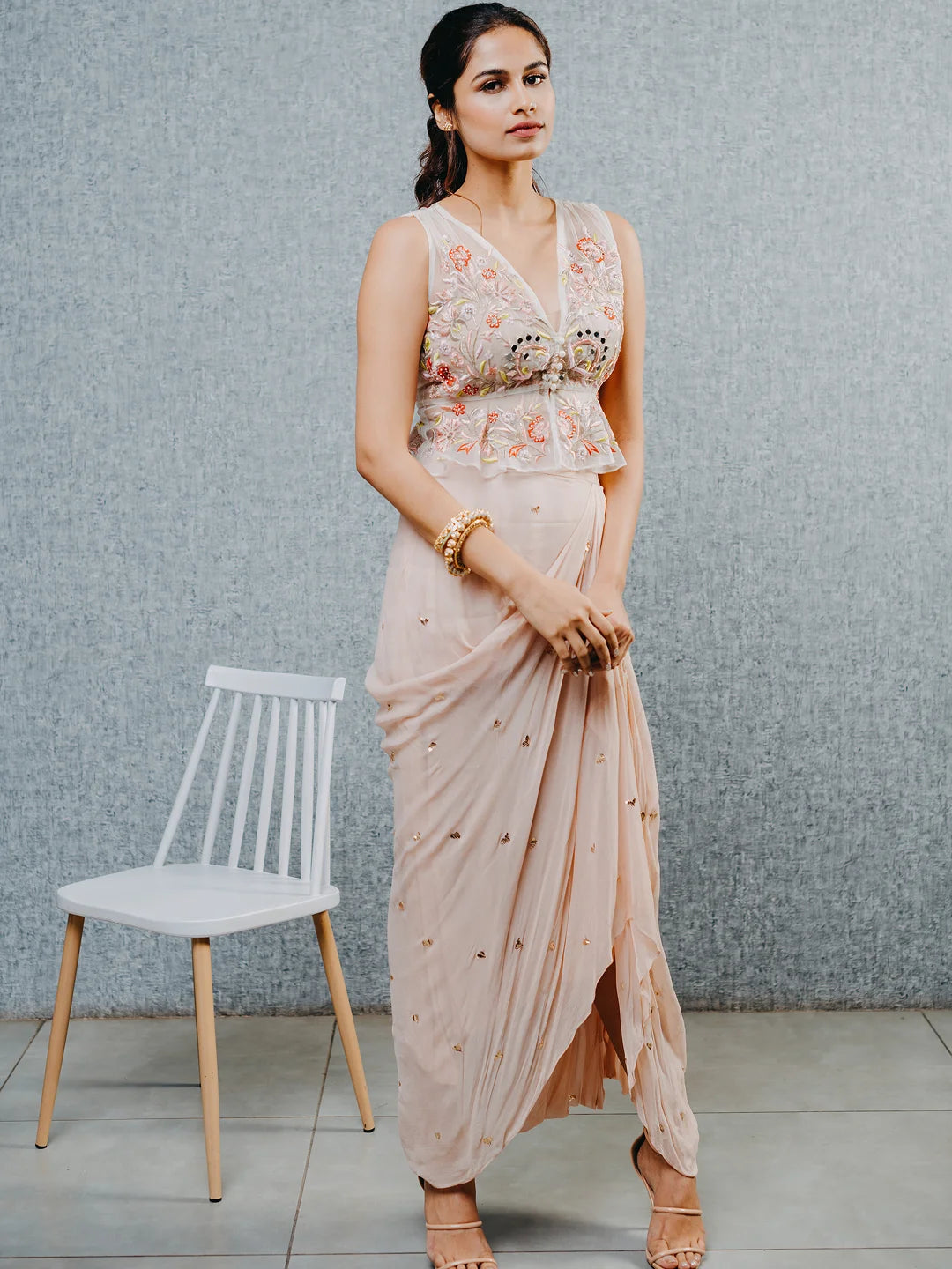 Peach draped skirt with embroidered peplum top