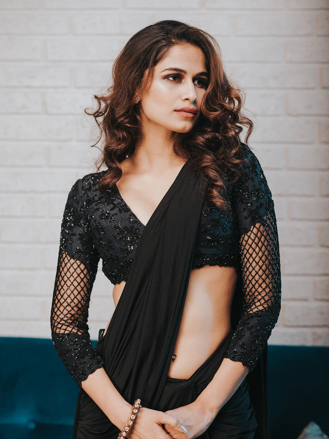 Black draped saree with embroidered blouse