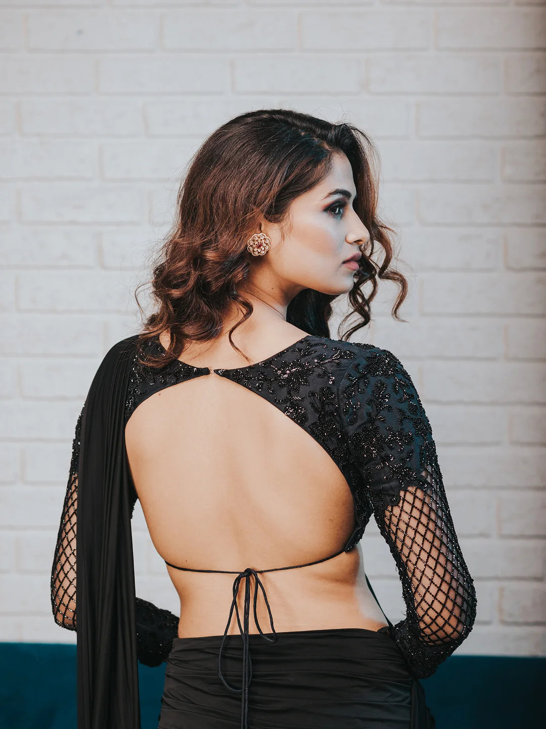 Black draped saree with embroidered blouse